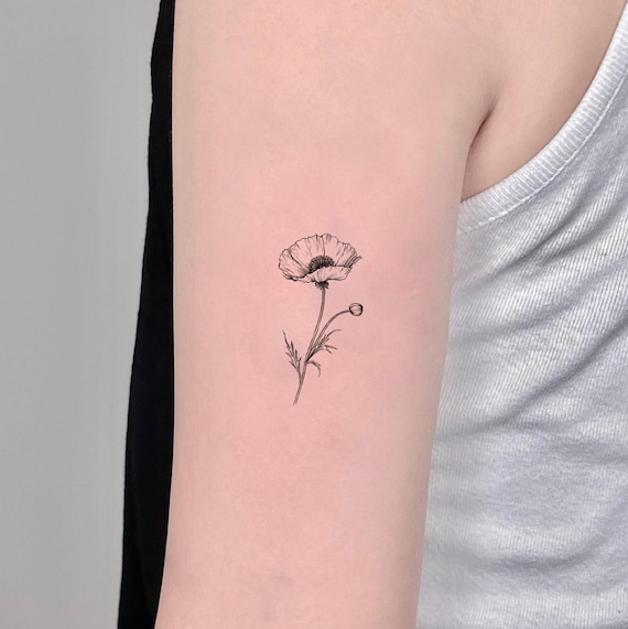 Fine line narcissus and poppy flower tattoo on the wrist. | Flower wrist  tattoos, Poppy flower tattoo, Flower tattoo