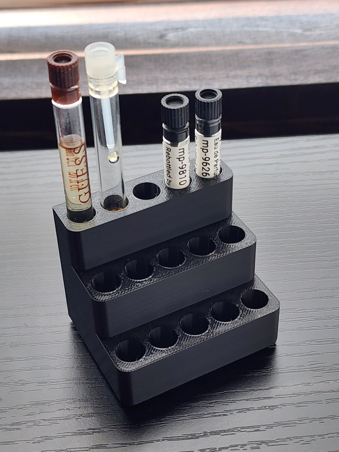 An individual vial holder that can holds up to six 4 ml (1 dram)
