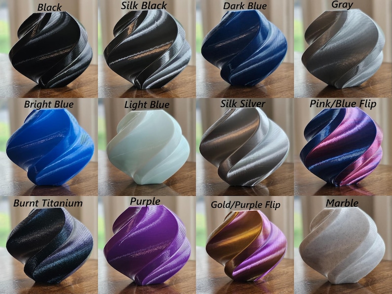 May include: Twelve 3D printed objects in various colors, including black, silk black, dark blue, gray, bright blue, light blue, silk silver, pink/blue flip, burnt titanium, purple, gold/purple flip, and marble.
