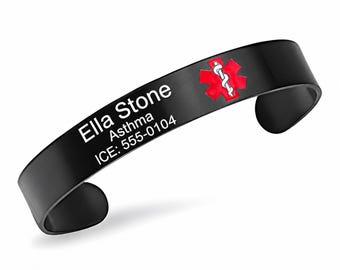 May include: A black cuff medical alert bracelet featuring a red Star of Life symbol with a white serpent and staff. The bracelet is engraved with the text Ella Stone, Asthma, and ICE: 555-0104 in white lettering on the front surface.