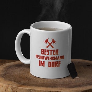 Feuerwehrmann, Geschenk für einen Feuerwehrmann, Fun Tasse mit Spruch, Lustige Tassen, Becher mit Aufdruck, Bester Feuerwehrmann im Dorf,