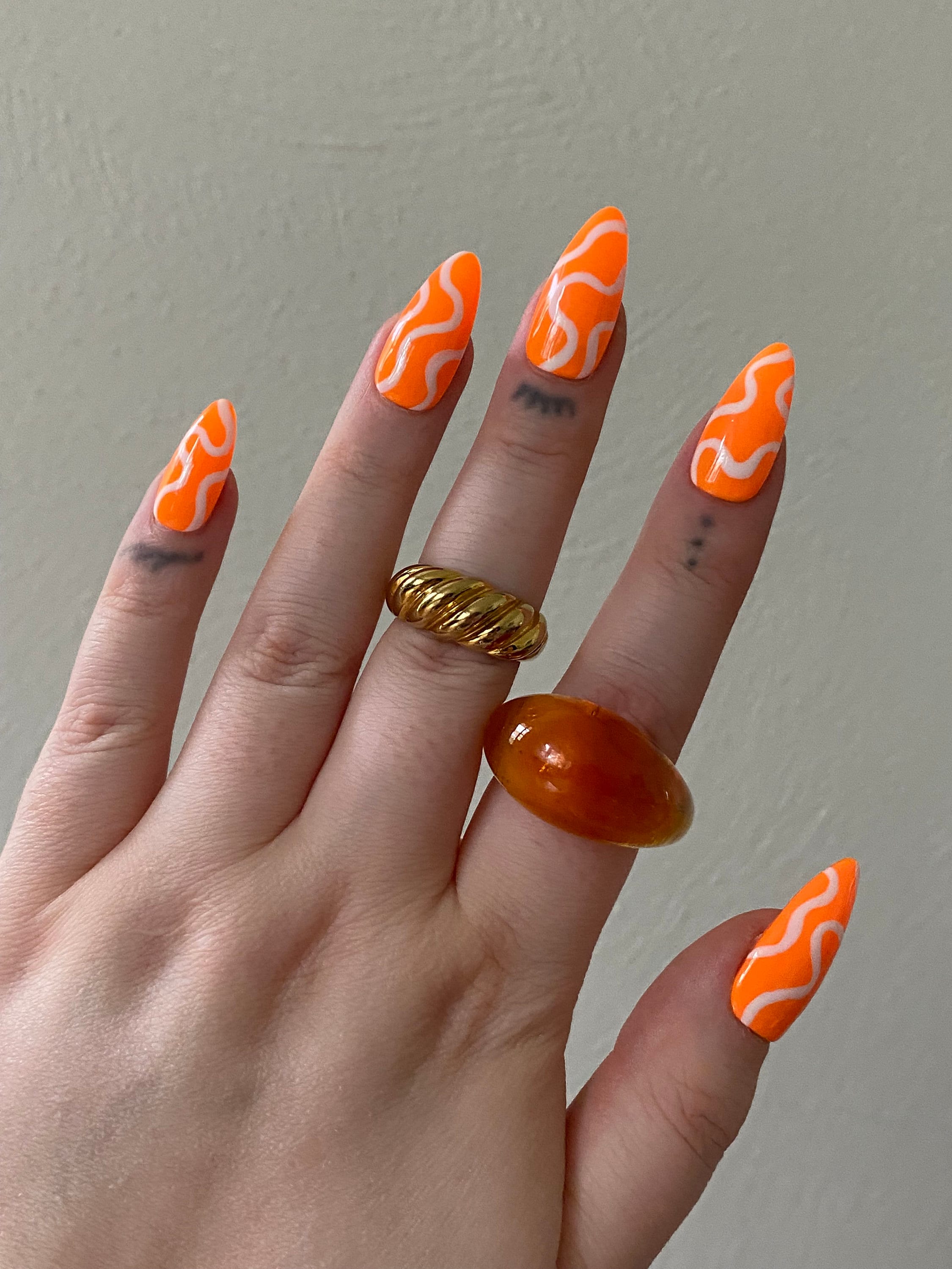Orange White Swirl Nails