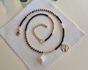 Handmade black and gold beaded necklace: freshwater pearl and gold hammered pendants