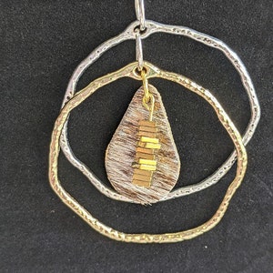 Two tone, reversible, adjustable necklace with leather accent