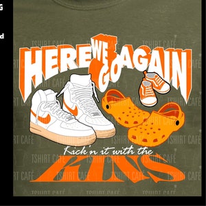 May include: A green t-shirt with an orange graphic design featuring the text "Here We Go Again" and "Kick'n it with the Kids". The graphic also includes images of sneakers and sandals.