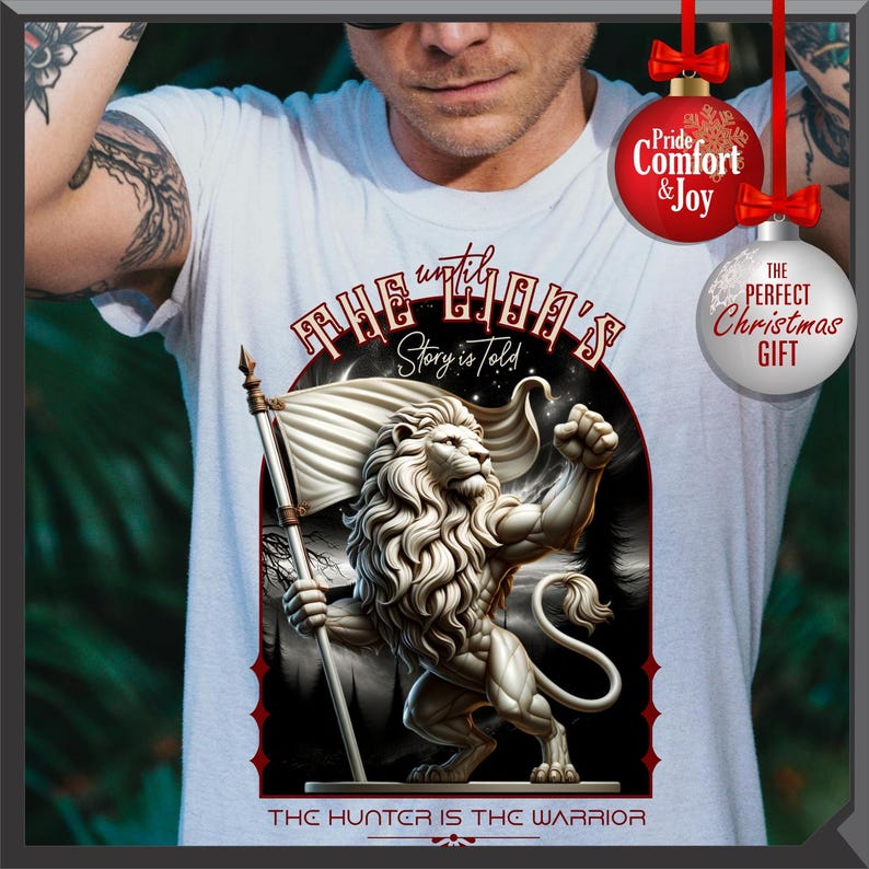 May include: White t-shirt with a detailed lion illustration holding a flag. The design includes the text "THE LION'S Story is Told" and "THE HUNTER IS THE WARRIOR". The shirt has a classic crew neck.