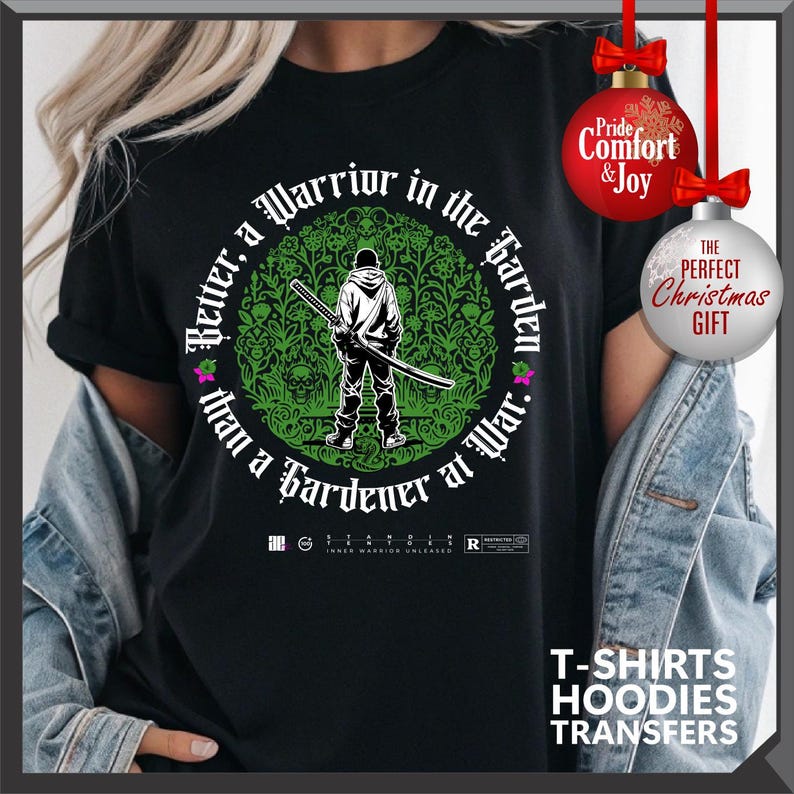 May include: Black t-shirt with a graphic of a person holding a sword inside a green floral circle. Text reads "Better, a Warrior in the Garden than a Gardener at War." Includes text "Pride, Comfort & Joy" and "The Perfect Christmas Gift."