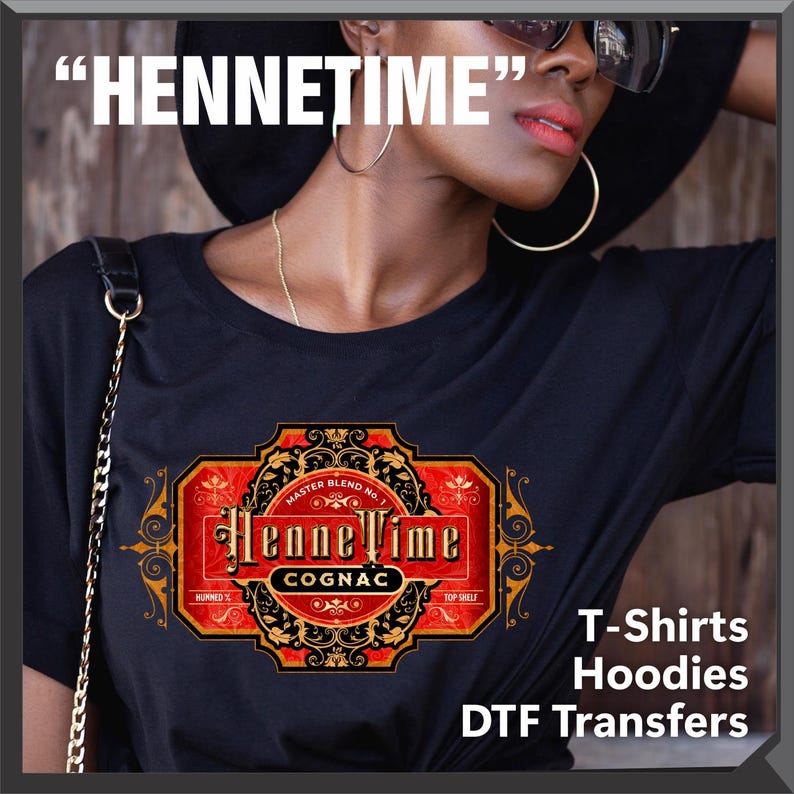May include: Black t-shirt with a HenneTime Cognac label design in red, gold, and black. The design includes the text "HenneTime" above the label and "T-Shirts Hoodies DTF Transfers" below.