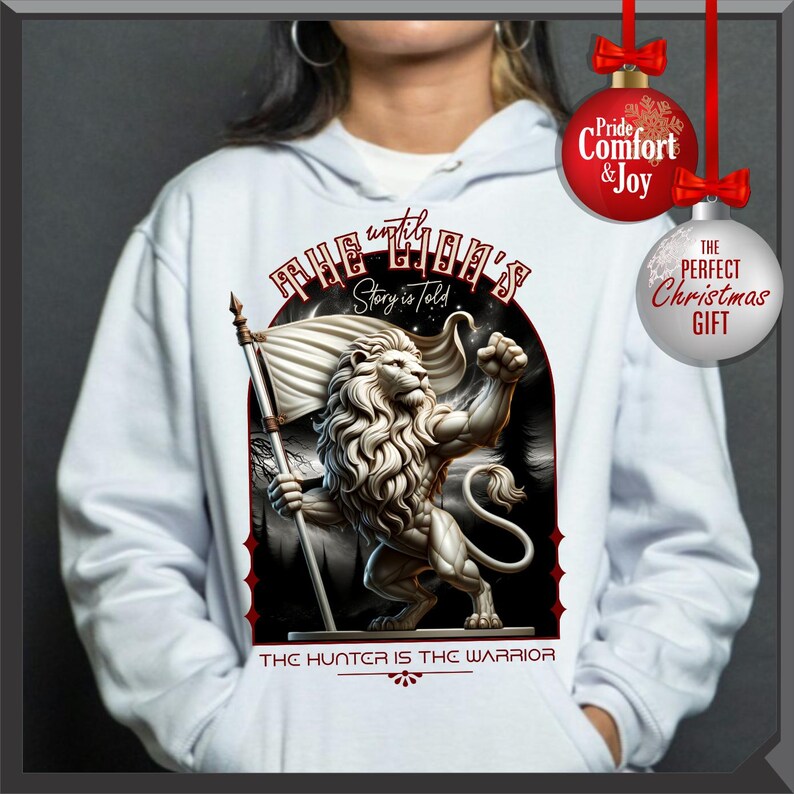 May include: White hoodie with a lion illustration holding a flag, and the text "THE LION'S Story is told" and "THE HUNTER IS THE WARRIOR". Includes red and silver Christmas ornaments.