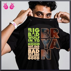 Puede incluir: Camiseta negra con el texto "BIG BAD WOLF IN YO NEIGHBORHOOD" en verde y naranja. El nombre "BRYAN" se muestra en una fuente texturizada. La camiseta tambi&eacute;n incluye el texto "NOT BAD MEANING BAD BUT BAD MEANING GOOD".