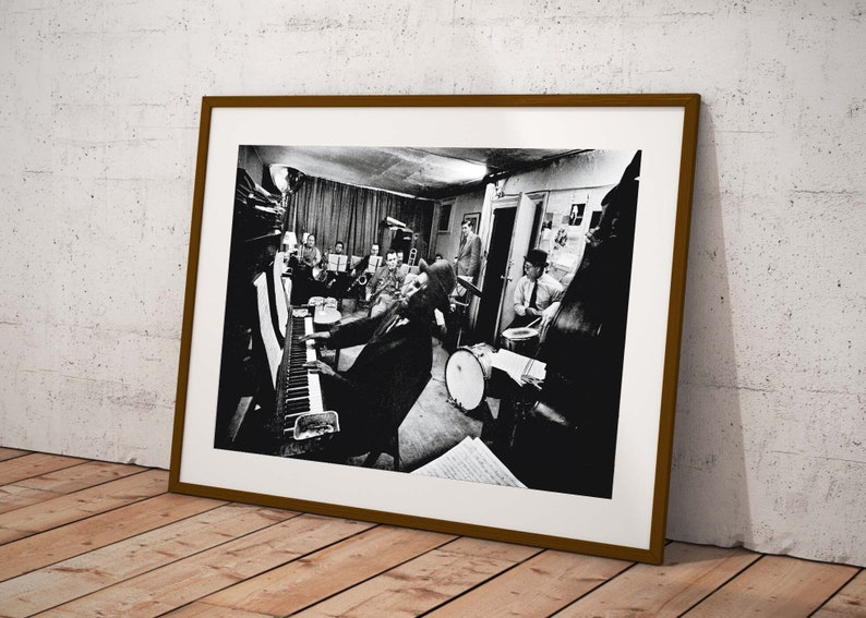 Capture a moment of jazz history with this iconic poster featuring Thelonious Monk and his orchestra at Town Hall in rehearsal, circa 1959.