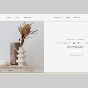 May include: Website design featuring a neutral color palette. A vase with dried flowers sits on a stack of books. The text reads "A Design Studio for Passionate Entrepreneurs."