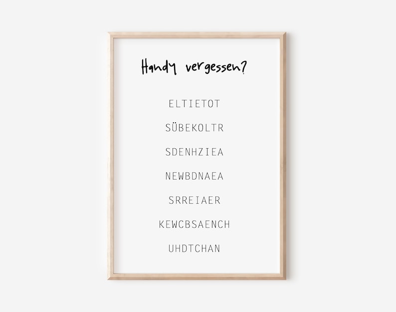 May include: A framed print with the text "Handy vergessen?" and a list of scrambled words: ELTIETOT, S&Uuml;BEKOLTR, SDENHZIEA, NEWBDNAEA, SRREIAER, KEWCBSAENCH, UHDTCHAN.