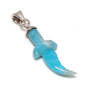 May include: A light blue pendant in the shape of a knife, with a silver-colored bail. The pendant has a curved blade and a knot-like design in the center. The text "jewelsbymaryland" is visible.