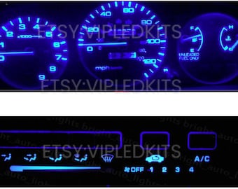 May include: A blue LED gauge cluster for a car with a speedometer, tachometer, fuel gauge, and temperature gauge. The gauges are illuminated with blue LEDs and the text "ETSY VIPLEDKITS" is visible on the gauges. The lower panel shows a blue LED climate control panel with buttons for A/C, fan speed, and other functions.