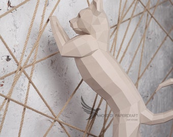 May include: A beige papercraft cat sculpture climbing a rope net against a white brick wall. The sculpture is detailed with geometric shapes and has a realistic pose. The text "WORD OF PAPERCRAFT ART STORE" is visible in the lower right corner.