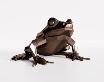 May include: A dark brown, low-poly geometric frog figurine with a faceted surface. The sculpture features sharp, angular edges and a smooth, metallic-like finish, capturing the seated posture of a frog with extended front and back legs.