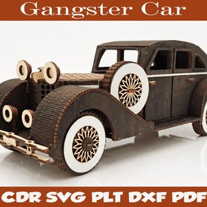 May include: A dark brown wooden model car with white wheel accents and intricate cut-out details. The text Gangster Car is at the top, and Digital Files CDR SVG PLT DXF PDF and Material: 4mm - 5.8mm are at the bottom of the image.