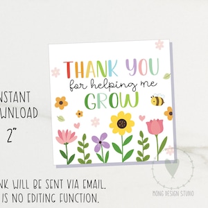 May include: A square card with the text "THANK YOU for helping me GROW" in colorful letters. The card features illustrations of flowers, a bee, and hearts. The card is 2 inches in size.
