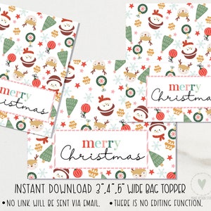 May include: Christmas bag toppers featuring a pattern of snowmen, reindeer, baubles, and trees. The words "merry Christmas" are displayed on a white label with a pink border. The bag toppers are 7.6 cm, 10.2 cm, and 12.7 cm wide.