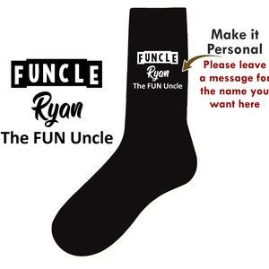 May include: Black and white socks with the text "FUNCLE Ryan The FUN Uncle" printed on them. The text is in a bold, white font. The socks are a fun gift for a fun uncle.