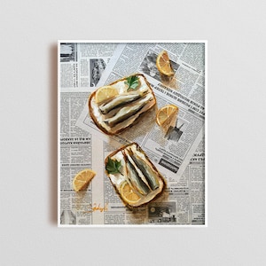 May include: Two open-faced sandwiches with white bread, cream cheese, and sardines on a newspaper background. The sandwiches are topped with parsley and lemon slices.