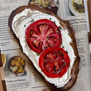 May include: A painting of a slice of toasted bread topped with white cream cheese and two slices of red tomato. The bread is on a brown surface. The painting is in a realistic style.
