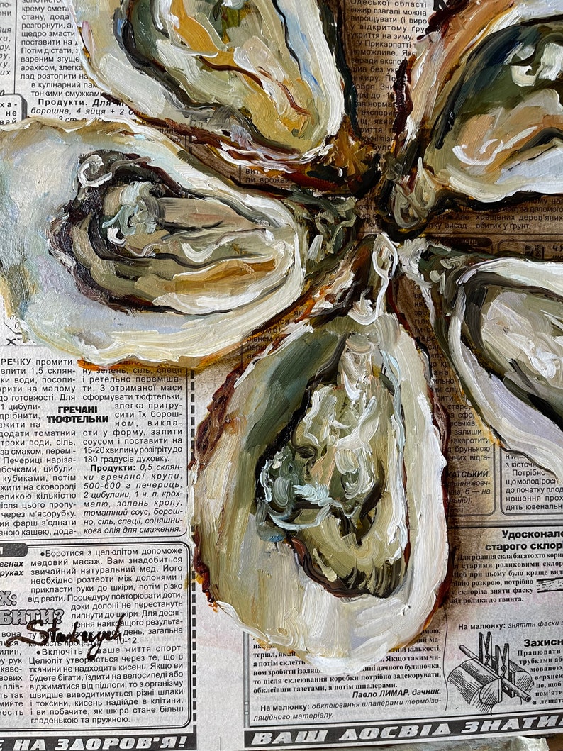 May include: A close-up of a painting of a flower with brown, green, and white paint. The flower is painted on top of a newspaper article with text about food and health.
