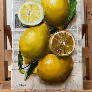 May include: An oil painting on canvas featuring bright yellow lemons and green leaves layered over a background of printed newspaper text titled The Digest. The composition includes two whole lemons and two halved lemons showing detailed pulp.