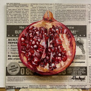 May include: A close-up of a halved pomegranate with red seeds and a white background. The pomegranate is painted in a realistic style with visible brushstrokes.