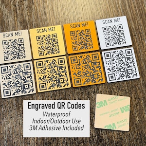 May include: A white ceramic mug with a black handle and the text "But First, Coffee" in a bold, black font. The mug is set against a blurred background, suggesting a cosy setting.