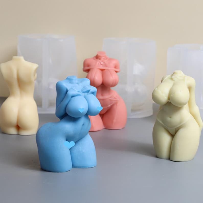 May include: Four silicone molds for making resin figures. The molds are shaped like different female body parts. The molds are shown with resin figures in them. The figures are in different colors, including pink, blue, and cream.