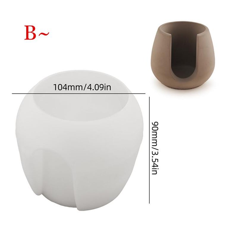 Puede incluir: Molde de silicona blanco para hacer un pastel redondo con un agujero en el centro. El molde tiene un di&aacute;metro de 10,4 cm y una altura de 9 cm.