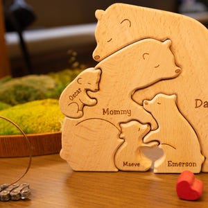 May include: Wooden bear family puzzle with the names "Daddy", "Mommy", "Emerson", "Maeve", and "Oscar" engraved on each bear.