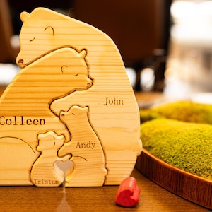 May include: Wooden bear family puzzle with the names Colleen, John, Andy, and Tristan engraved on each bear.