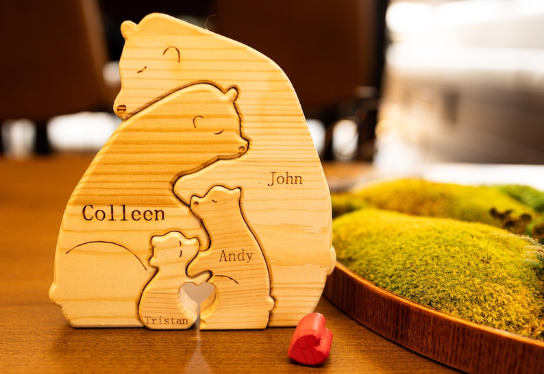 May include: Wooden bear family puzzle with the names Colleen, John, Andy, and Tristan engraved on each bear.