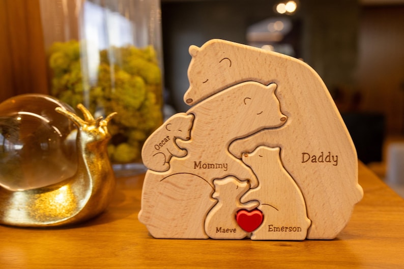 May include: Wooden bear family puzzle with the names "Daddy", "Mommy", "Oscar", "Emerson", "Maeve" and a red heart.
