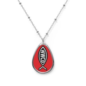 May include: Silver-toned necklace with a pendant featuring a red background and a white fish symbol with the letters "WWCD" in black. The pendant has a silver border and hangs from a delicate chain.