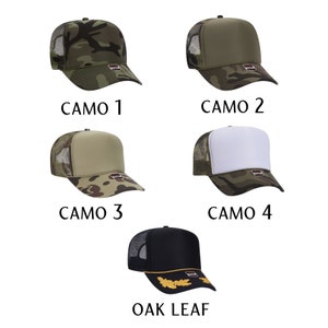 May include: Five trucker hats in different camouflage patterns and one black trucker hat with a gold oak leaf design. The hats are all mesh backed and have a flat brim.