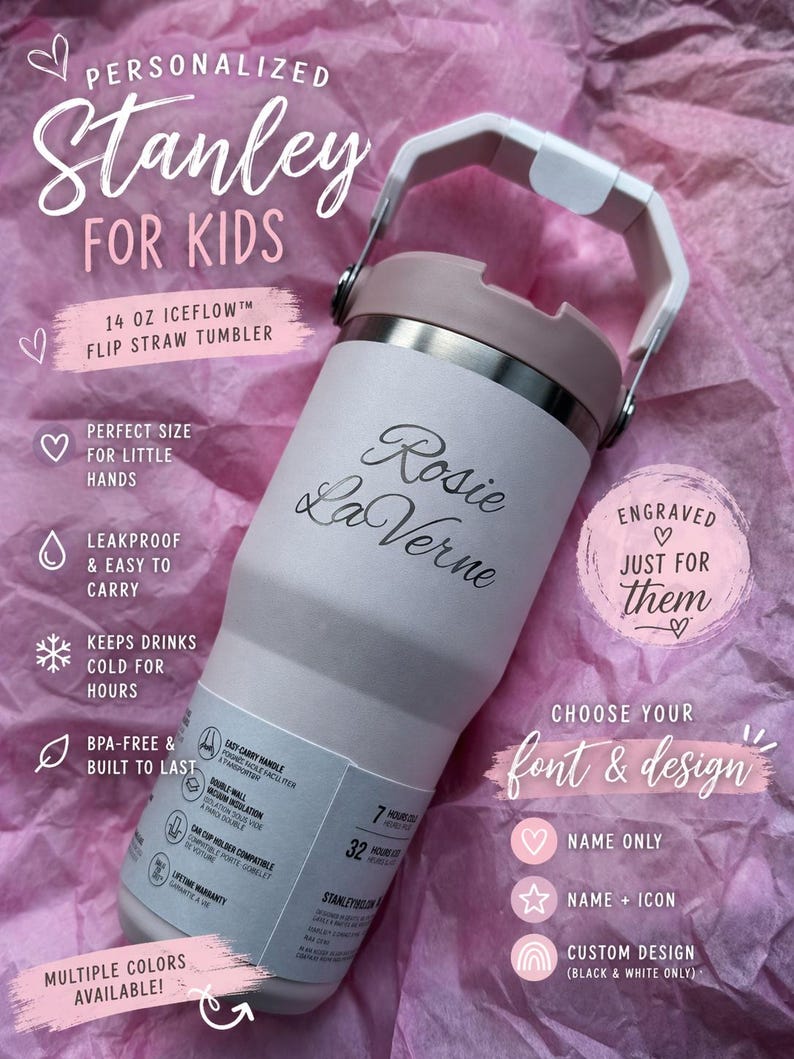 May include: A personalized Stanley 14 oz Iceflow flip straw tumbler for kids. The white and pink insulated tumbler has the name "Rosie La Verne" engraved on it. Features include a handle, leakproof design, and the ability to keep drinks cold for hours.