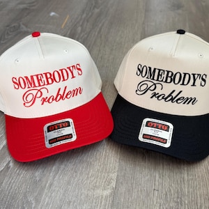 Somebody&#39;s Problem Trucker Hat: Embroidered Country Girl Cap