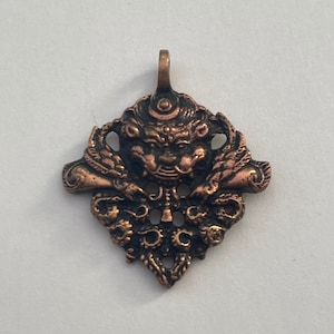 Beautiful Handmade Copper Chhepu Pendant from Nepal.