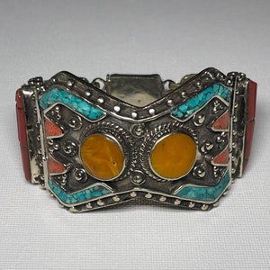 Fine Handmade Himalayan White brass bracelet with inlaid stones of amber,torquise & coral from Nepal.  Beautiful wearable bracelet.