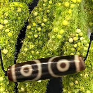 Beautiful three eyes Dzi Bead  with nice usaged of Patina,Great size &  excellent color.