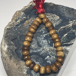 Fine handmade 8mm Buddhist prayer bead bracelet made from Yak Bone in the Himalayas.