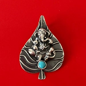Superb handmade Mini vintage Silver pendant of Ganesh on the peepal leaf with  torquise on the bottom from Nepal.