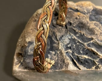Beautiful handmade copper & brass braided healing cuff bracelet from Nepal for men and women.