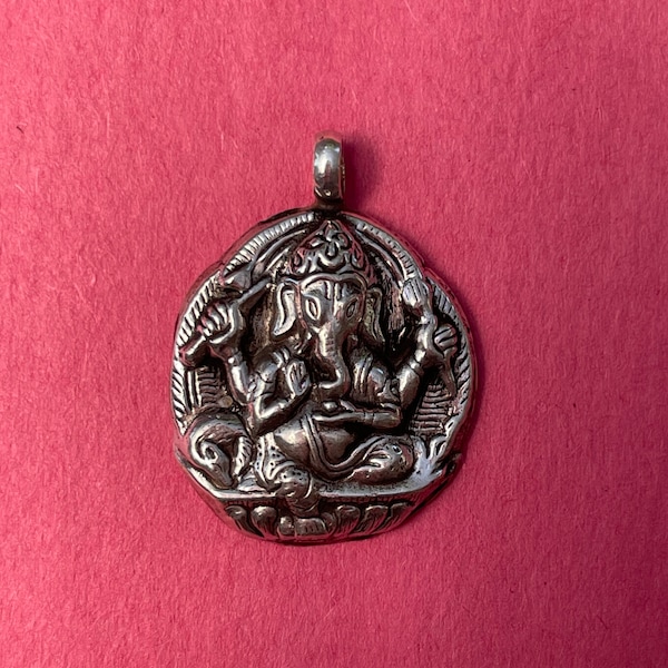 Beautiful Handmade Silver Ganesh Pendant from Nepal.It is a hollow sterling silver Ganesh pendant & light.