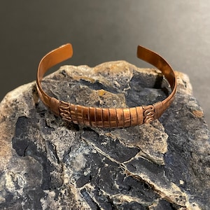 Beautiful handmade copper healing cuff bracelet with interesting twisted wired copper design on centerpiece from Nepal.All adjustable.