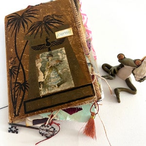 Homemade altered vintage book junk journal handheld with  pockets, tags, stitching
